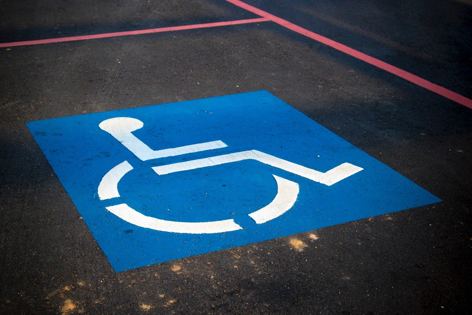 accessible logo on a parking spot