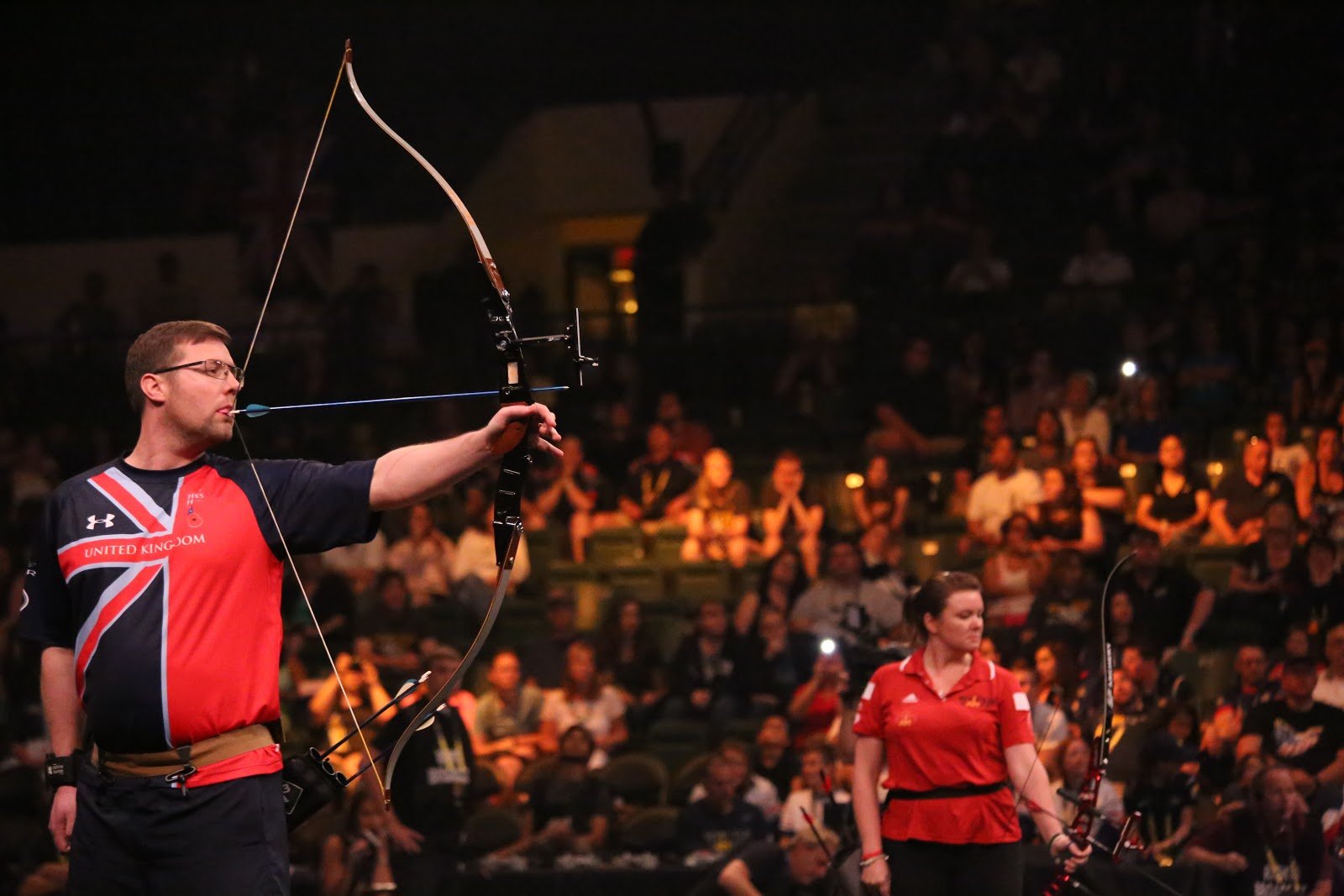 man holding bow and arrow