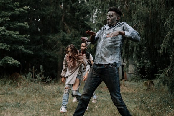 Zombies walking through forest